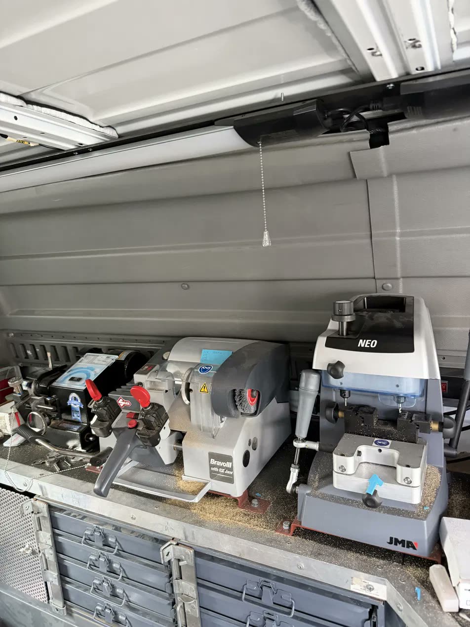 Inside the van: three key cutting and programming machines and parts drawers